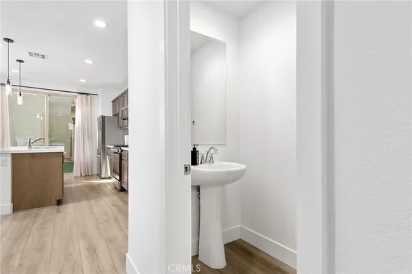 a bathroom with a sink and mirror