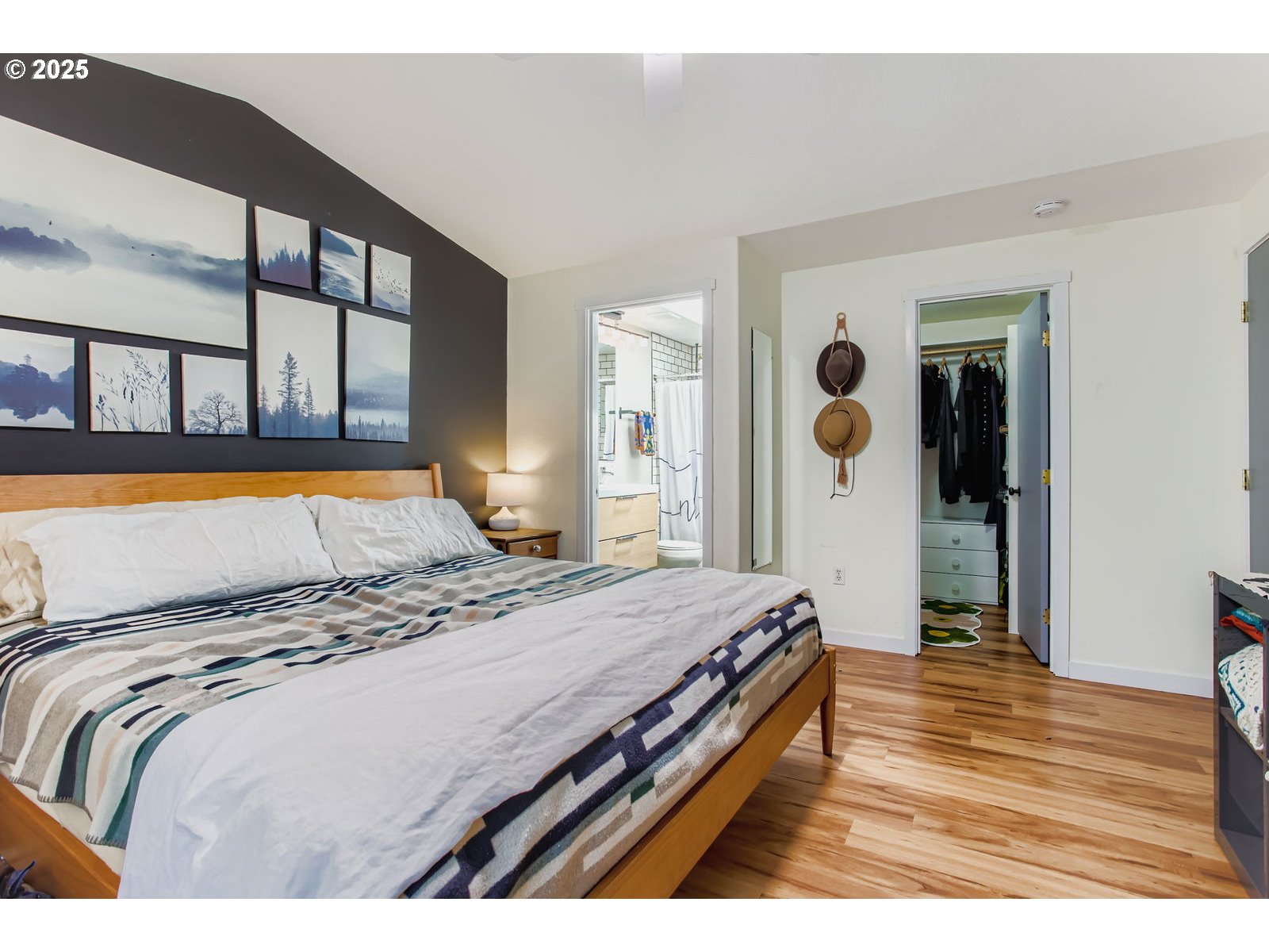 1144 Southwest Ivory Loop, Unit 35 Gresham, OR 97080 - Photo 10 of 28 a bedroom with a bed and a large mirror