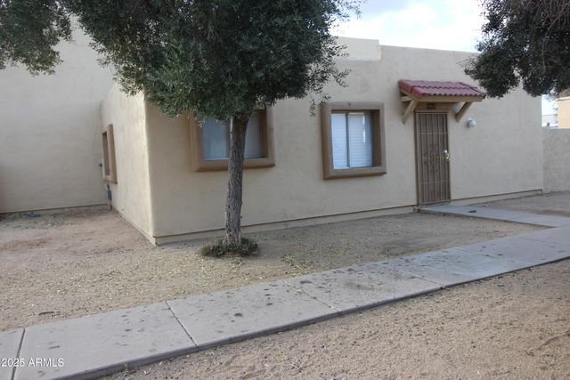 a view of a house with a tree