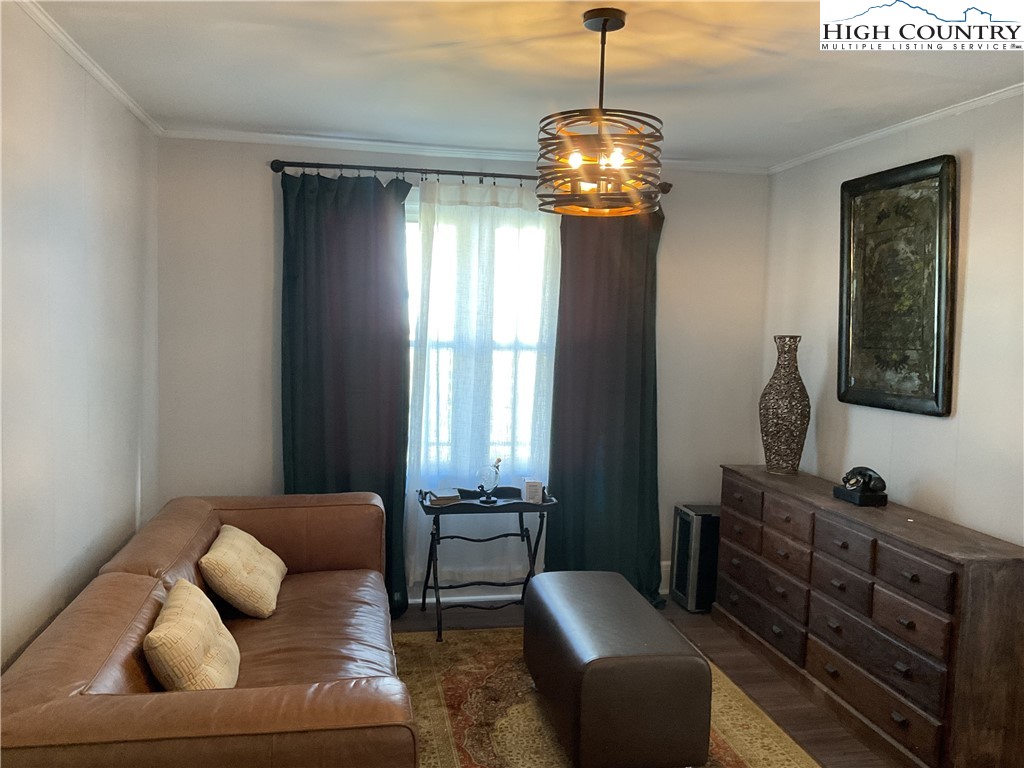 4560 Highway 18 Sparta, NC 28675 - Photo 19 of 43 a living room with furniture and a chandelier