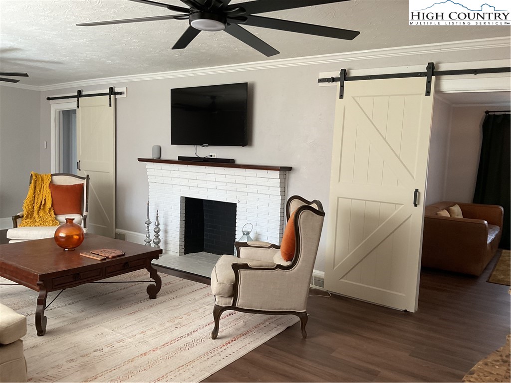 4560 Highway 18 Sparta, NC 28675 - Photo 23 of 43 a living room with furniture and a flat screen tv