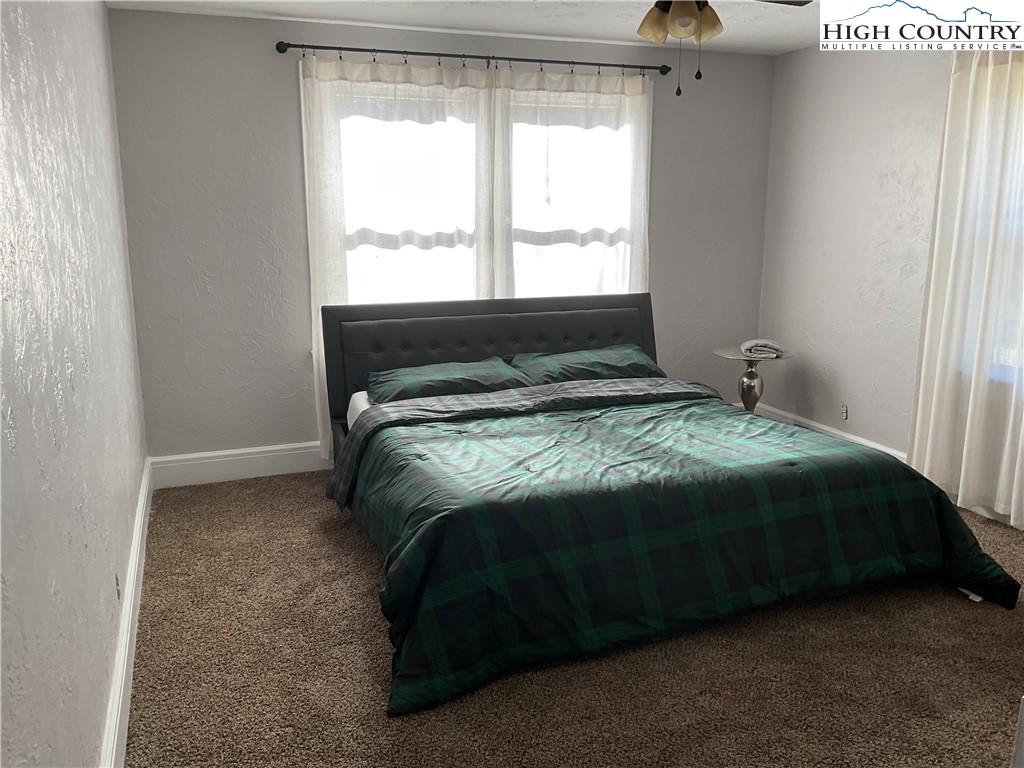 4560 Highway 18 Sparta, NC 28675 - Photo 25 of 43 a bedroom with a bed and window