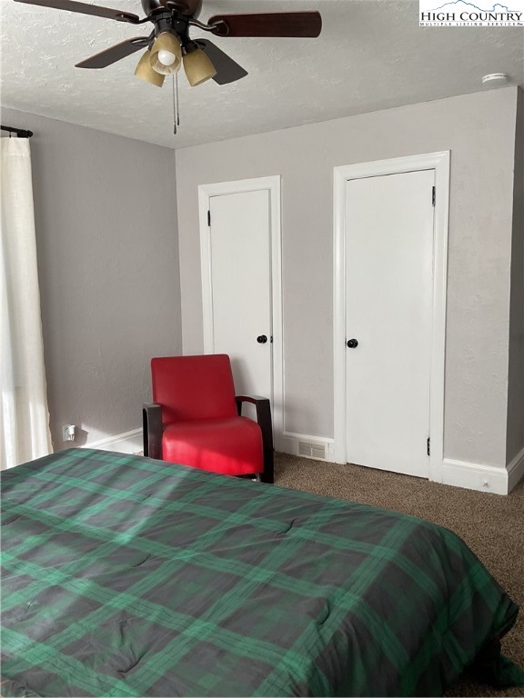 4560 Highway 18 Sparta, NC 28675 - Photo 26 of 43 a bedroom with a bed and a chandelier