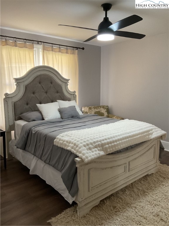 4560 Highway 18 Sparta, NC 28675 - Photo 27 of 43 a bedroom with a bed and a chandelier