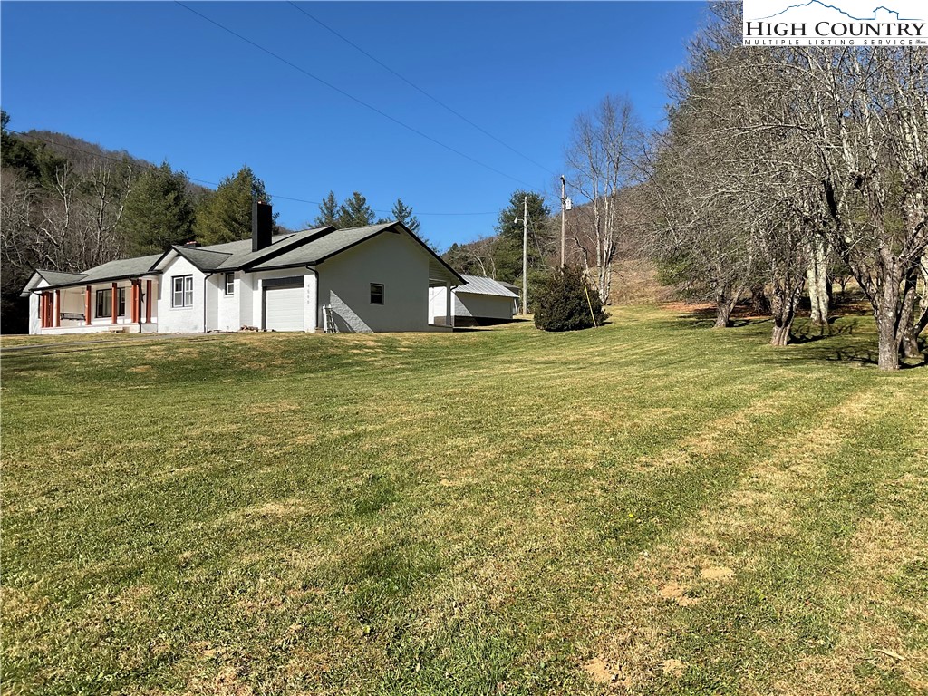 4560 Highway 18 Sparta, NC 28675 - Photo 3 of 43 a front view of a house with a yard