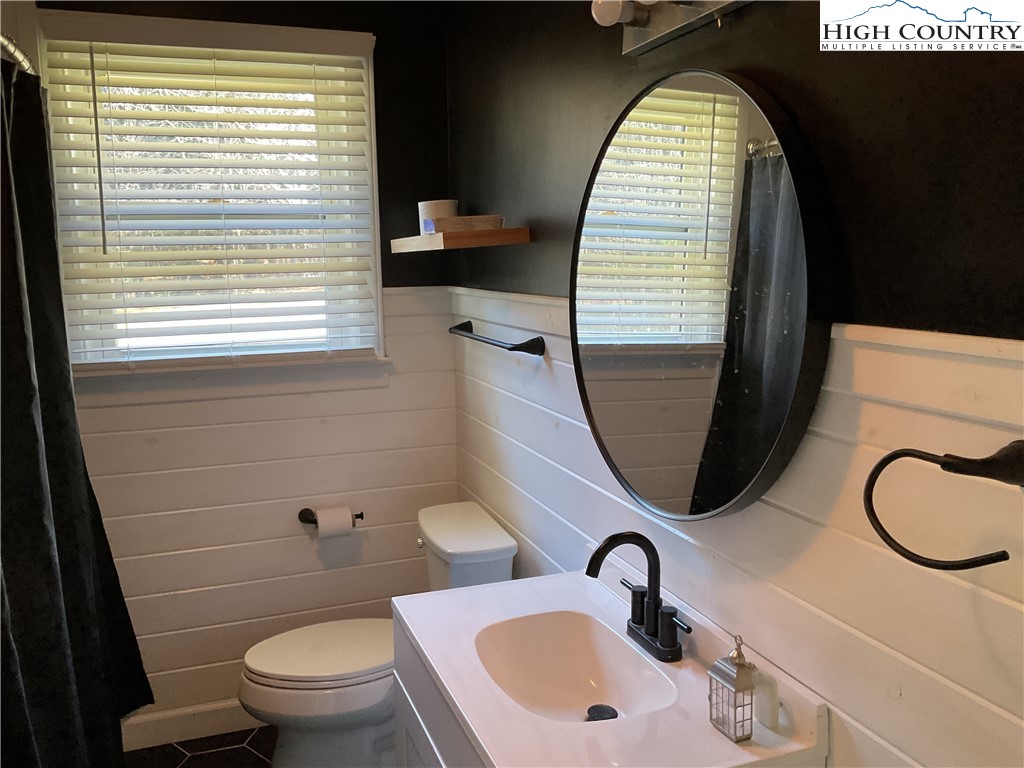 4560 Highway 18 Sparta, NC 28675 - Photo 31 of 43 a bathroom with a sink and a mirror