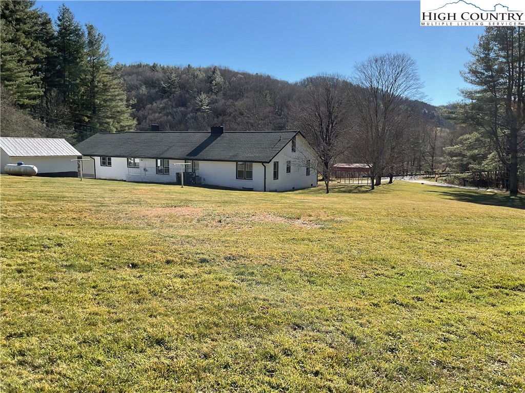 4560 Highway 18 Sparta, NC 28675 - Photo 9 of 43 a view of a house with a yard