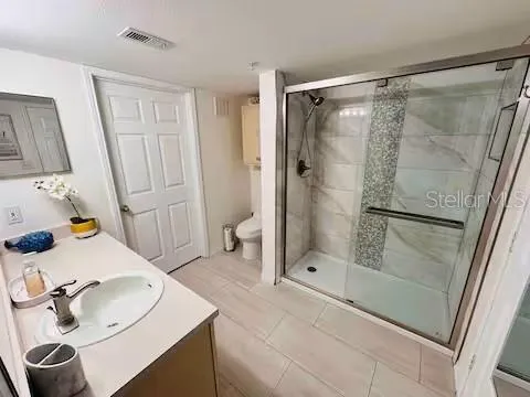 a bathroom with a sink and a shower