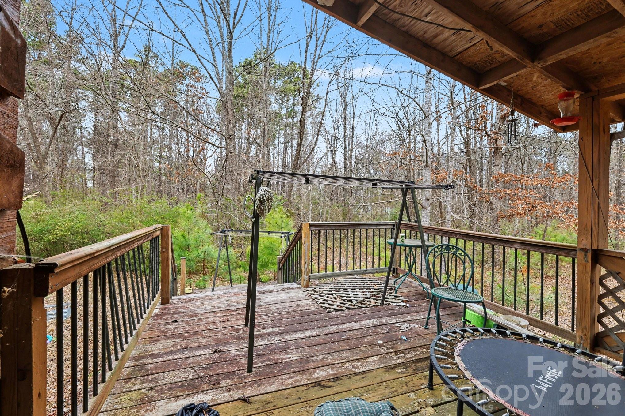 10217 Bethel Church Road Midland, NC 28107 - Photo 12 of 18 a view of a porch with wooden floor and fence