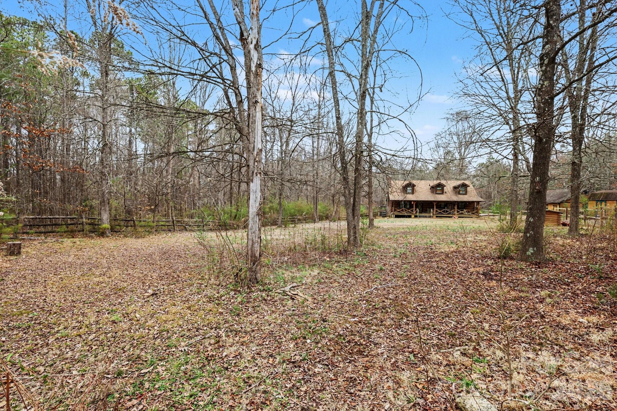 10217 Bethel Church Road Midland, NC 28107 - Photo 16 of 18 a backyard of a house with lots of green space