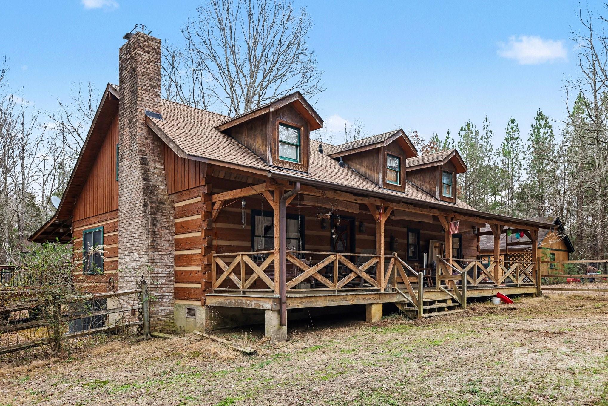 10217 Bethel Church Road Midland, NC 28107 - Photo 2 of 18 a view of a wooden house with large trees