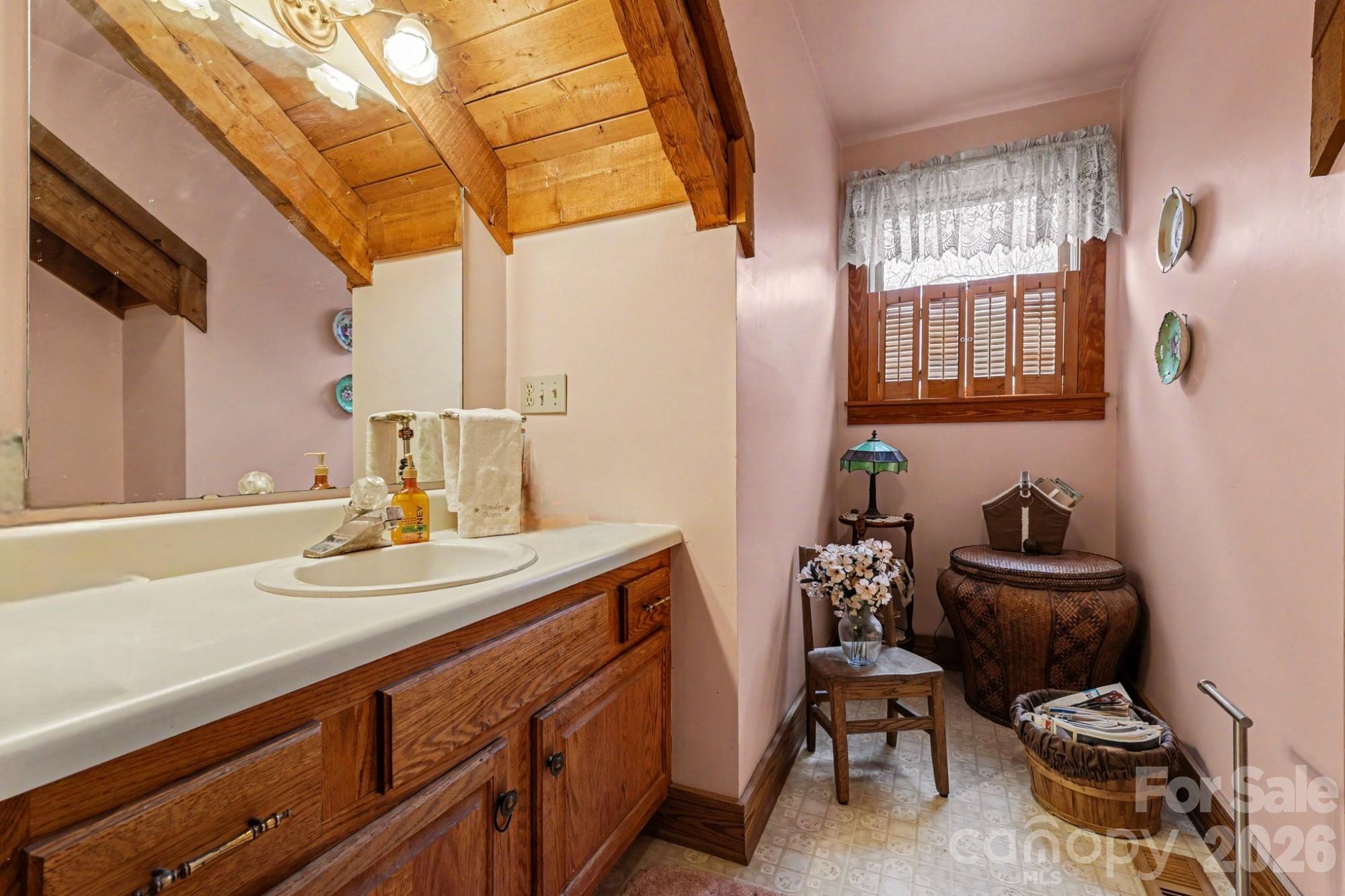 10217 Bethel Church Road Midland, NC 28107 - Photo 7 of 18 a bathroom with a sink a chair and a window