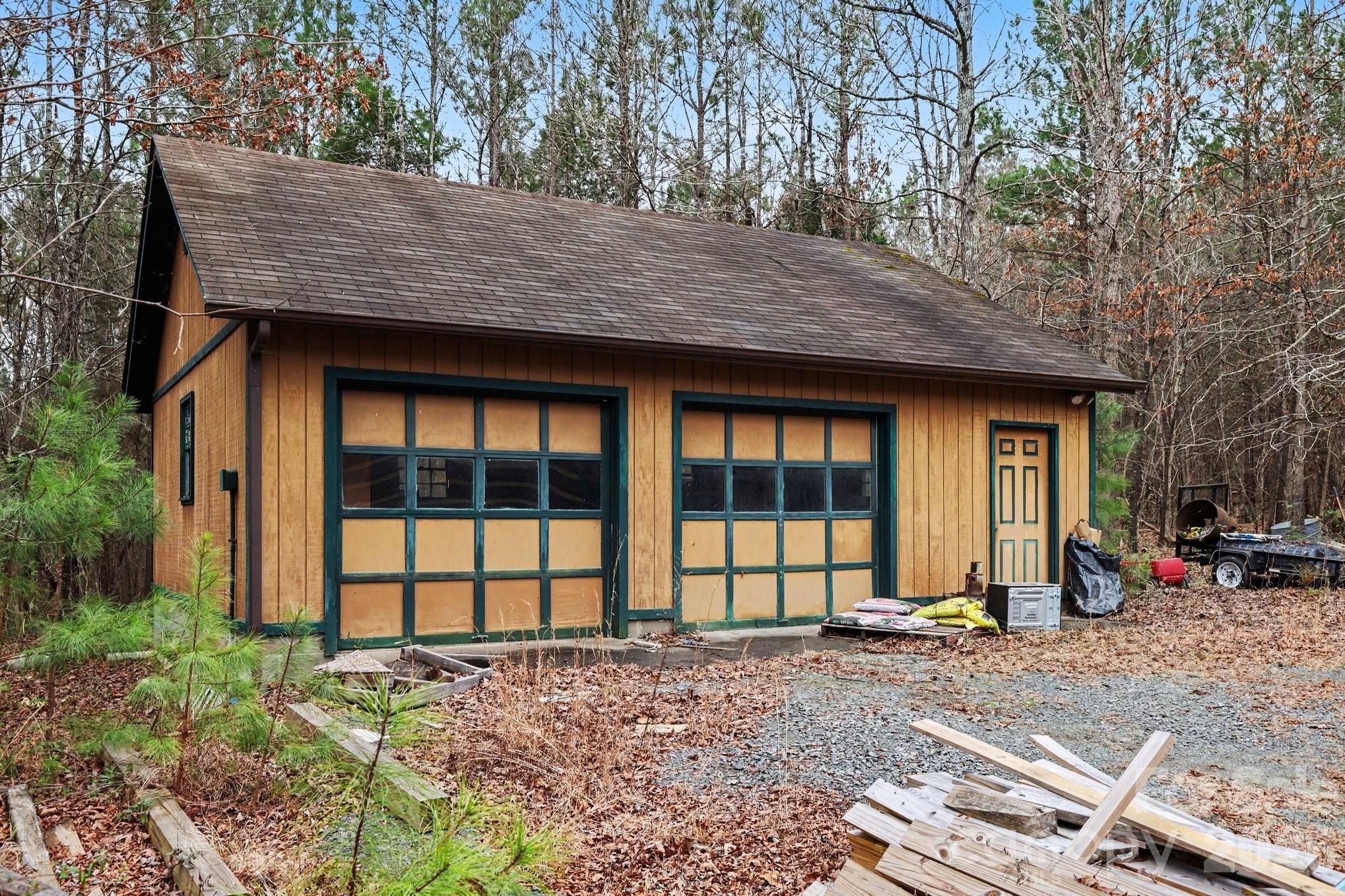10217 Bethel Church Road Midland, NC 28107 - Photo 10 of 18 a view of a house with large windows and a yard