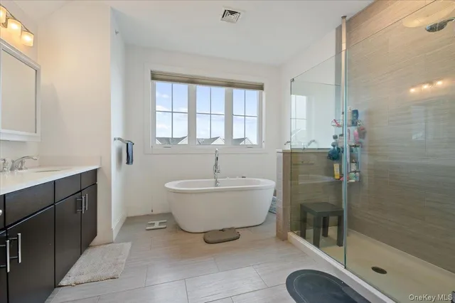 a bathroom with a bathtub sink and toilet