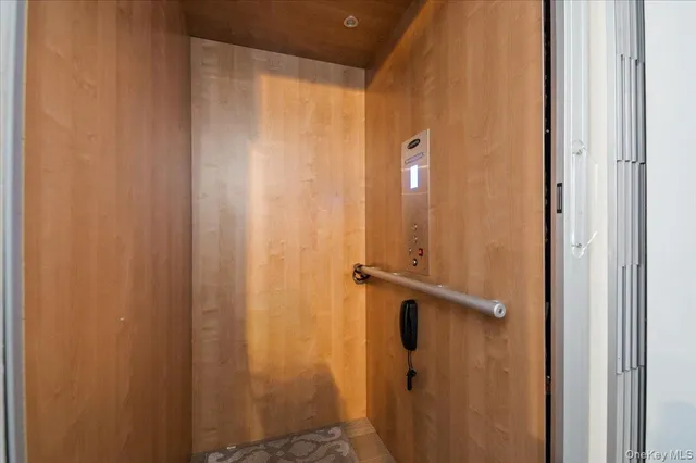 a bathroom with a shower and a door