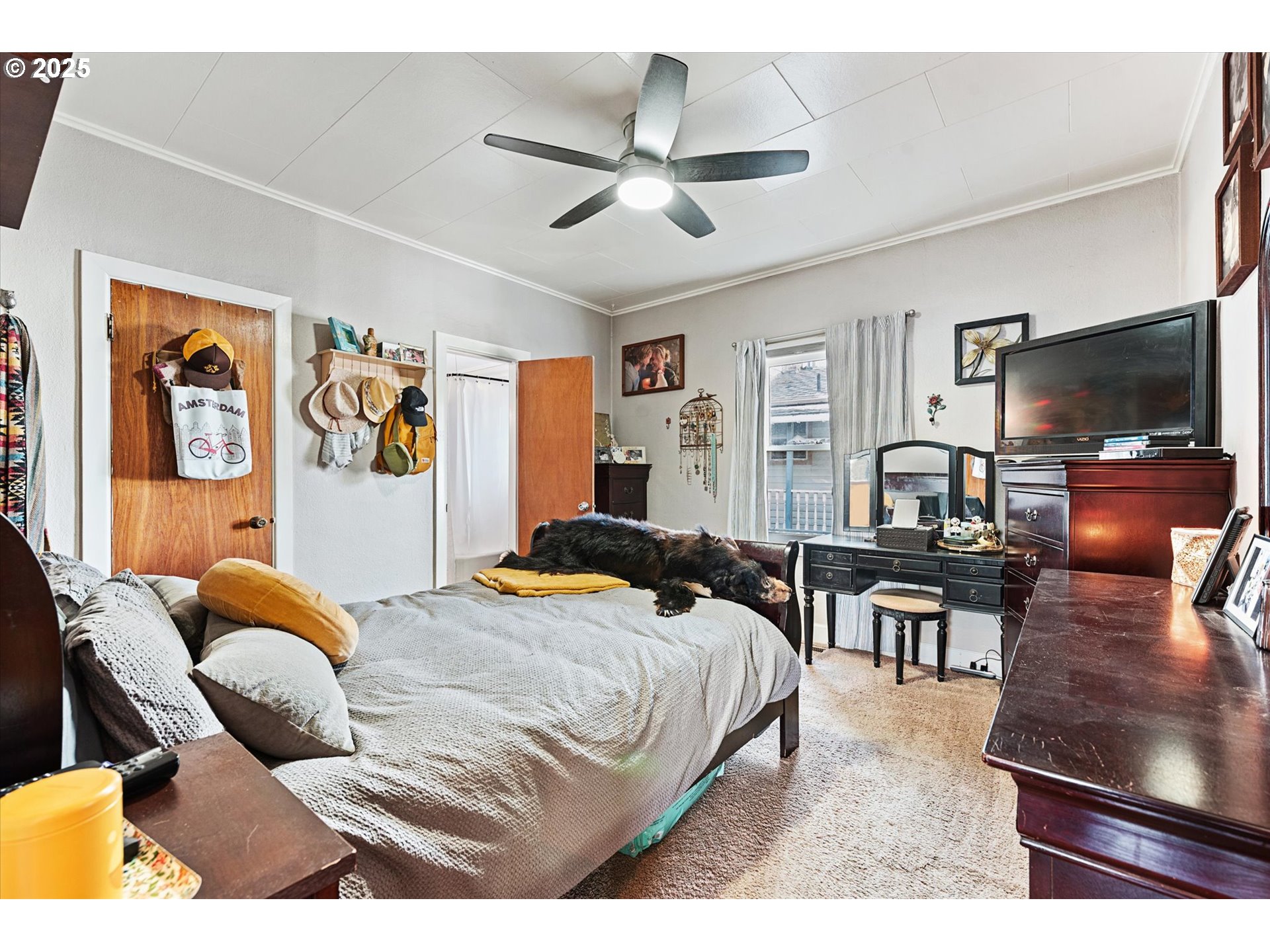 1410 Valley Avenue Baker City, OR 97814 - Photo 15 of 28 a bedroom with a bed and wooden floor