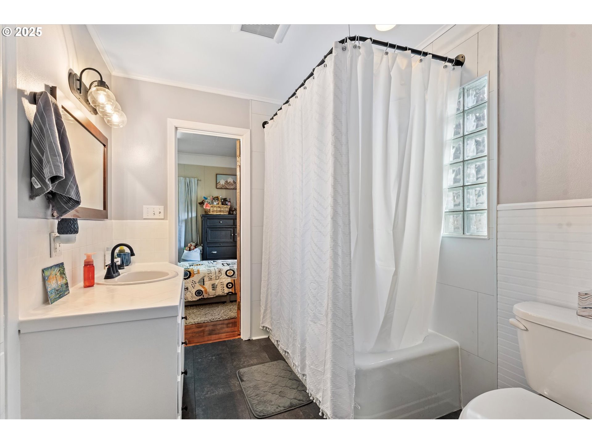 1410 Valley Avenue Baker City, OR 97814 - Photo 17 of 28 a bathroom with a sink a toilet and shower