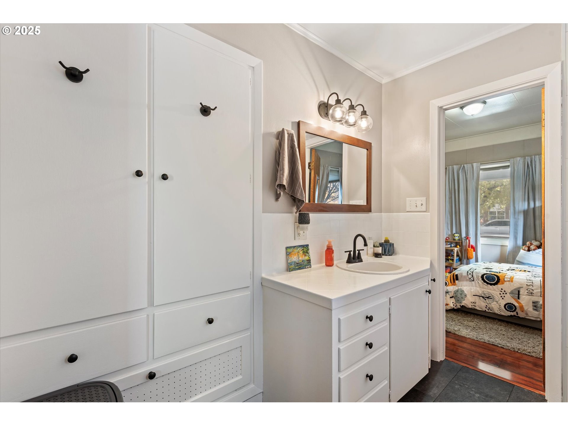 1410 Valley Avenue Baker City, OR 97814 - Photo 18 of 28 a en suite bathroom with a double vanity sink and mirror