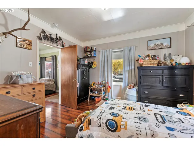 a bedroom with a bed and a dresser