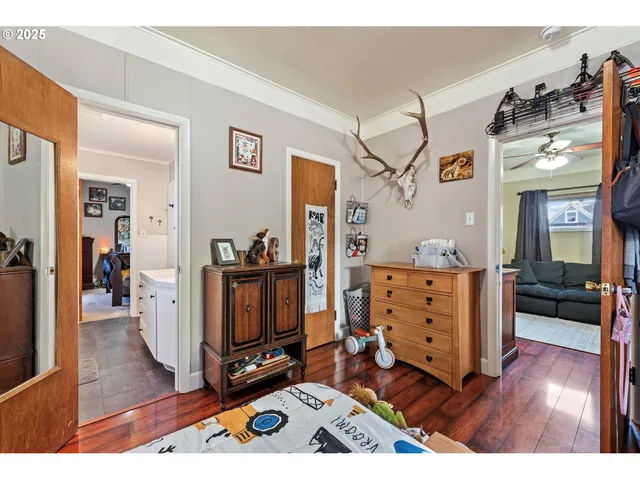 a view of living room with furniture and wooden floor