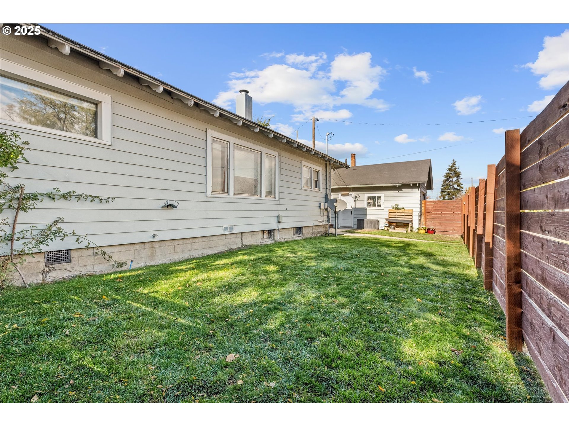 1410 Valley Avenue Baker City, OR 97814 - Photo 25 of 28 a view of a backyard with plants and a backyard