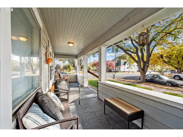 a living room with a couch and large windows