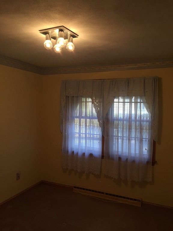 6 Edward Street Canton, MA 02021 - Photo 9 of 16 an empty room with a empty space and windows