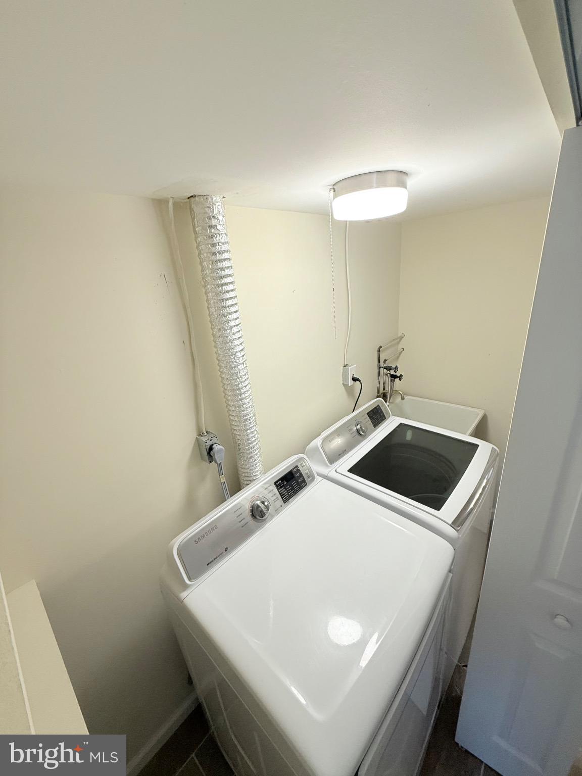 7250 Lasting Way Columbia, MD 21045 - Photo 27 of 39 Modern laundry space with sleek appliances.