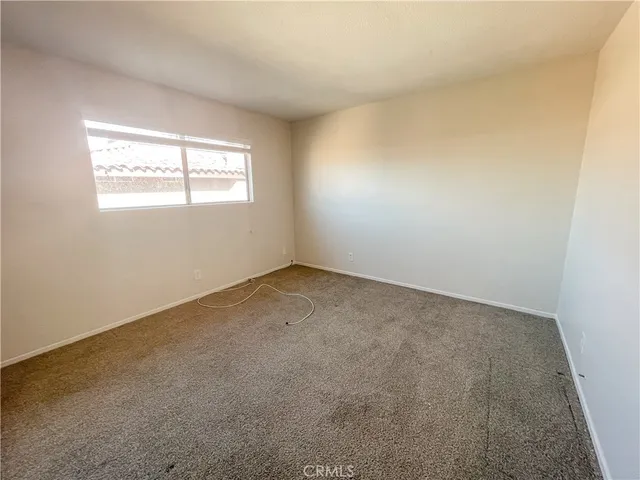 en empty room with windows