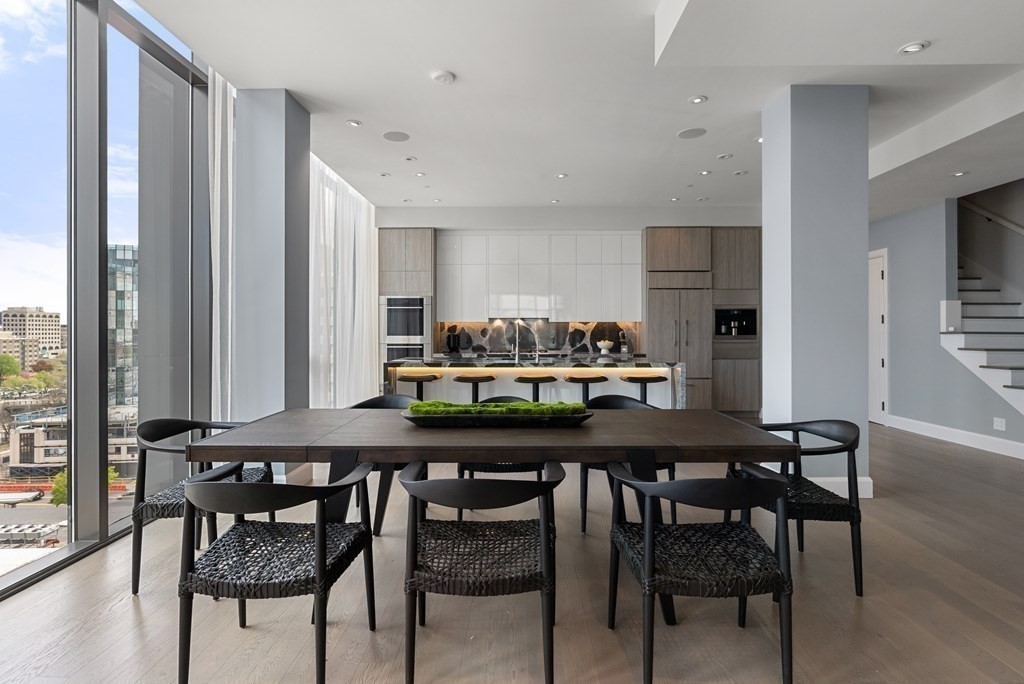 140 Shawmut Avenue, Unit 8A Boston, MA 02118 - Photo 11 of 29 a kitchen with a table and chairs in it