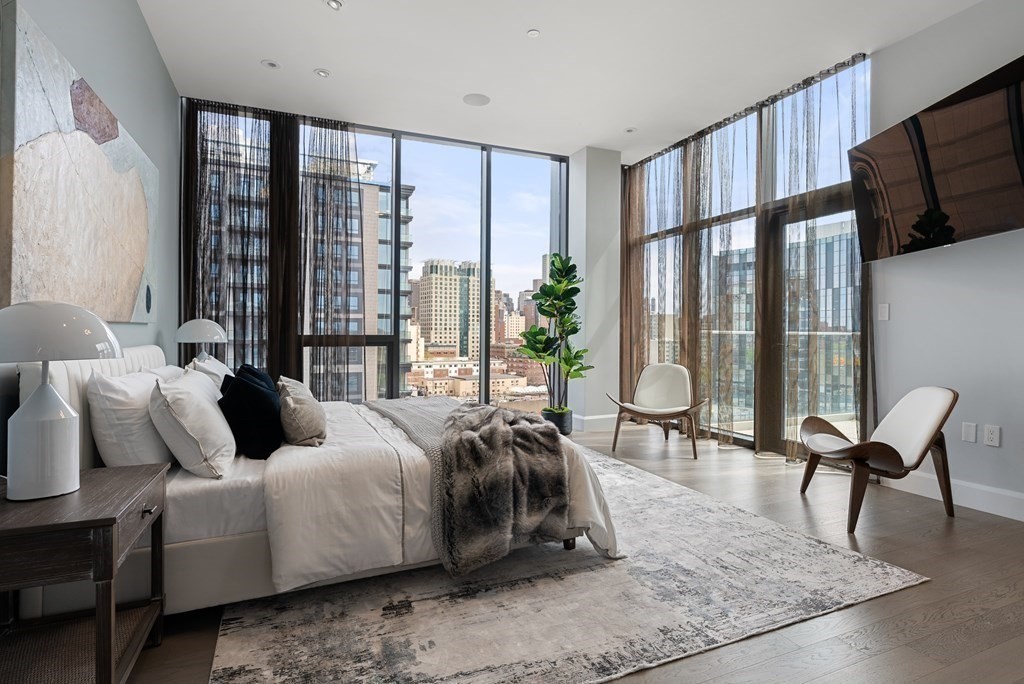 140 Shawmut Avenue, Unit 8A Boston, MA 02118 - Photo 16 of 29 a living room with furniture fireplace and large window