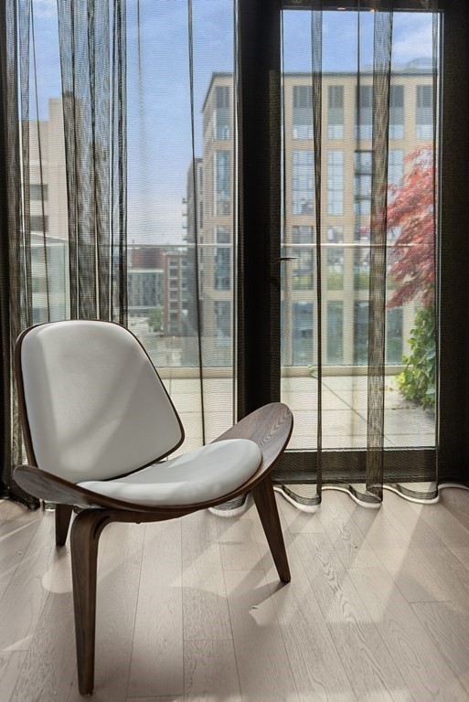 140 Shawmut Avenue, Unit 8A Boston, MA 02118 - Photo 17 of 29 a view of a room with gym equipment and floor to ceiling window