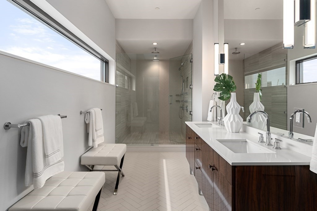 140 Shawmut Avenue, Unit 8A Boston, MA 02118 - Photo 19 of 29 a bathroom with double vanity and a bathtub