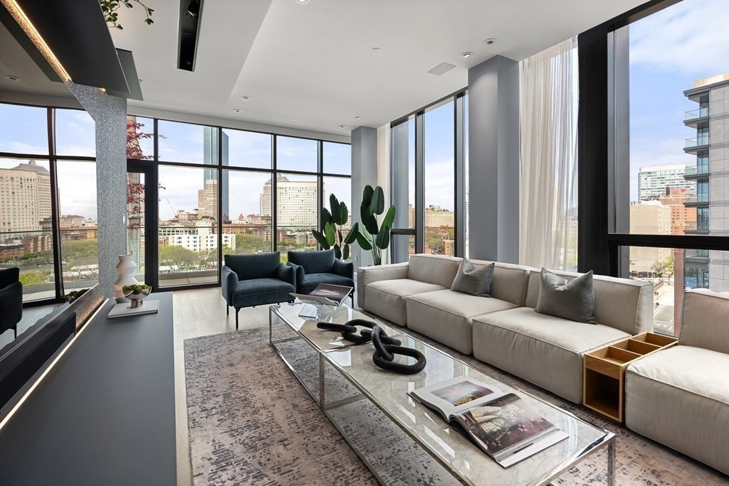 140 Shawmut Avenue, Unit 8A Boston, MA 02118 - Photo 4 of 29 a living room with furniture and a large window