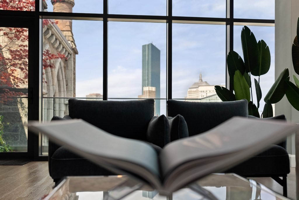 140 Shawmut Avenue, Unit 8A Boston, MA 02118 - Photo 6 of 29 a living room with furniture and a window