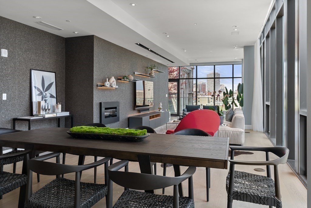 140 Shawmut Avenue, Unit 8A Boston, MA 02118 - Photo 9 of 29 a view of a dining room with furniture and wooden floor