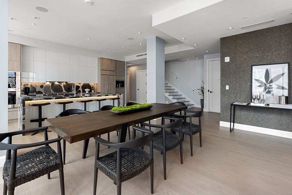 140 Shawmut Avenue, Unit 8A Boston, MA 02118 - Photo 10 of 29 a view of a dining room with furniture and wooden floor