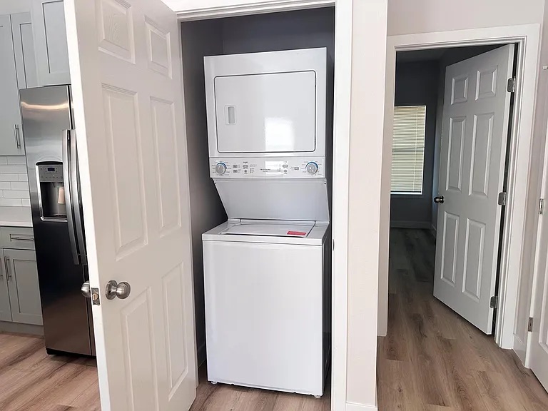 817 5th Street Lockhart, TX 78644 - Photo 11 of 18 a view of storage and utility room with washer and dryer