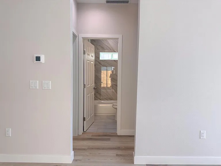 817 5th Street Lockhart, TX 78644 - Photo 12 of 18 a view of a bathroom from a hallway