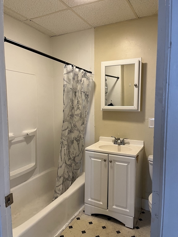 61 Vine Street, Unit 35 Lynn, MA 01905 - Photo 3 of 11 a bathroom with a sink a toilet and shower