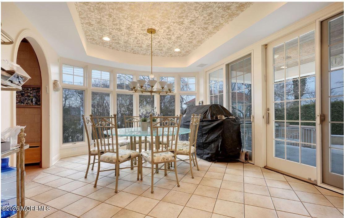57 Darlington Road Deal, NJ 07723 - Photo 18 of 27 a view of a dining room with furniture wooden floor and chandelier
