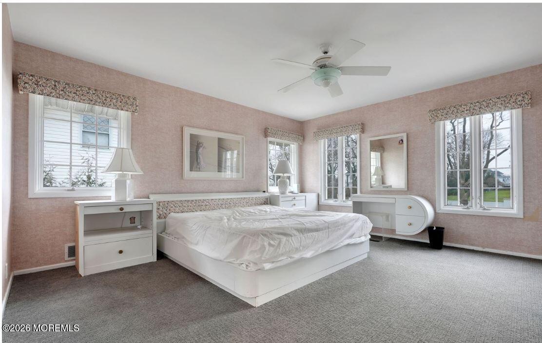 57 Darlington Road Deal, NJ 07723 - Photo 24 of 27 a spacious bedroom with a bed and a large window
