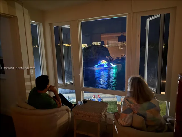 a living room with furniture and a lamp
