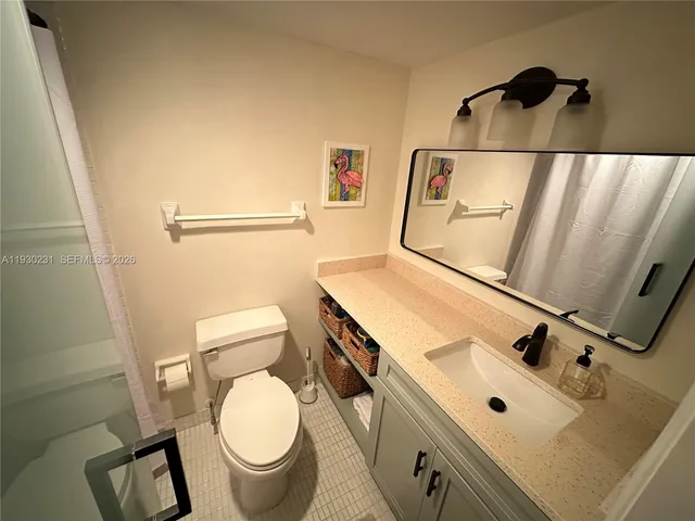 a bathroom with a toilet and a sink