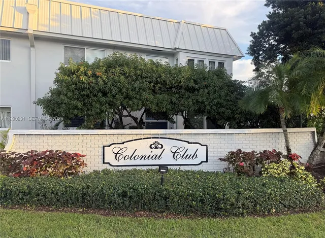 a view of outdoor space with signage and flags