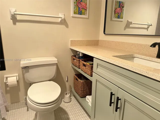 a bathroom with a toilet and a sink