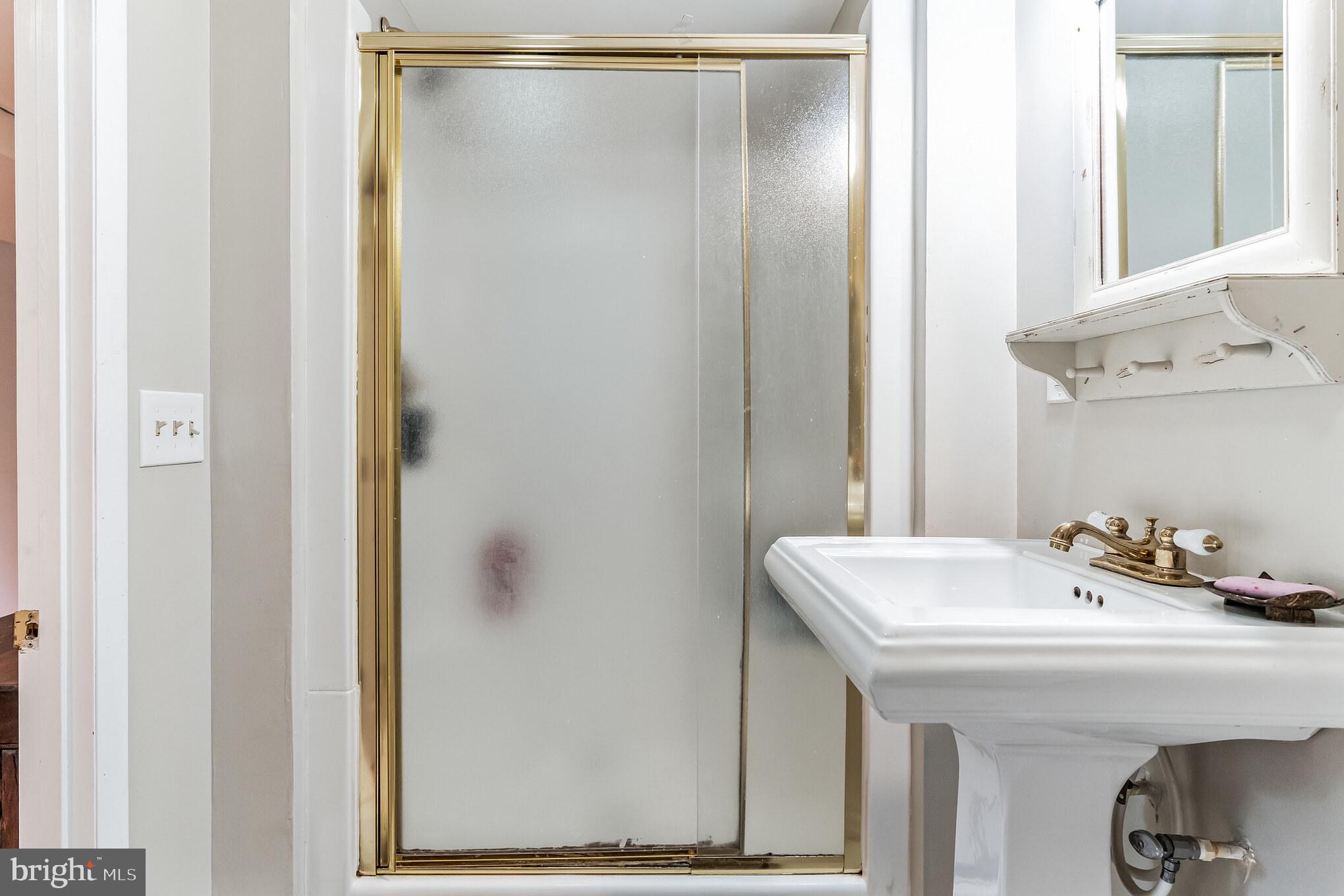 9329 Harvey Road Silver Spring, MD 20910 - Photo 26 of 40 a bathroom with a sink and mirror