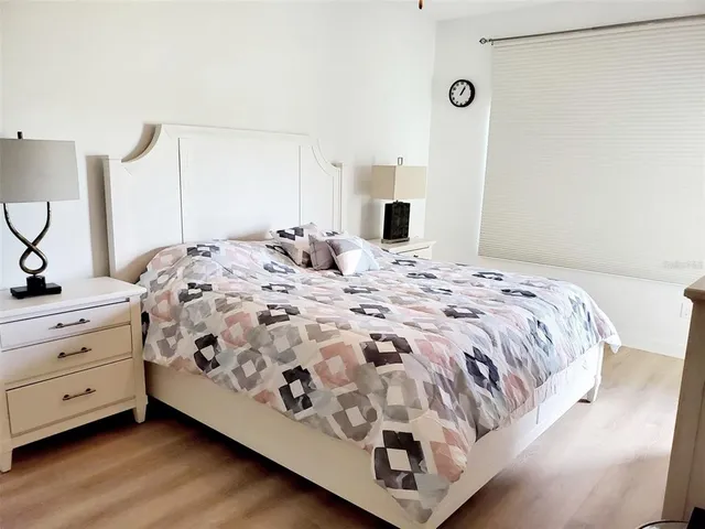 a bedroom with a bed and a dresser