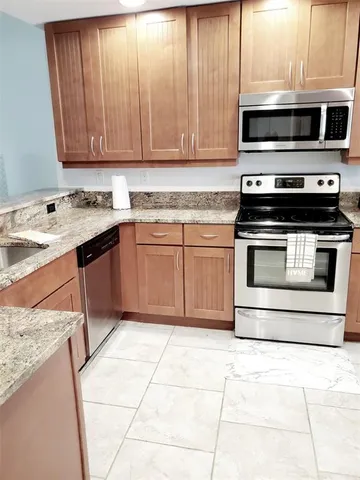 a kitchen with a stove and a microwave
