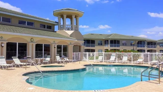 a view of house with outdoor seating